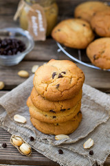 Peanut butter cookies with chocolate chips on wooden background