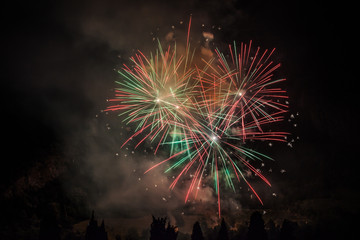 Fototapeta na wymiar Colorful fireworks of traditional Santa Augusta celebration, Vittorio Veneto, Italy