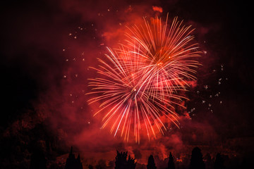 Fototapeta na wymiar Colorful fireworks of traditional Santa Augusta celebration, Vittorio Veneto, Italy