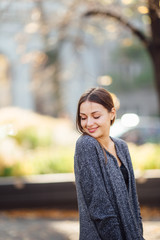 Girl stand on the street and smile to camera