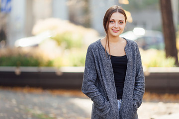 Girl stand on the street and smile to camera