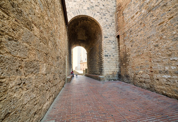 stone arch in street of San Gimignano