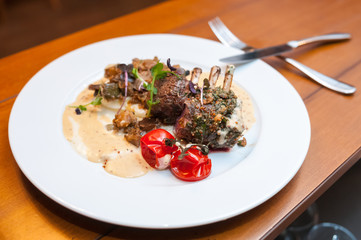 Lamb with potatoes and mushrooms sauce in the french restaurant.