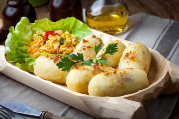 Potato dumplings stuffed with minced meat.