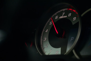 Acceleration. Tachometer of the sports car.