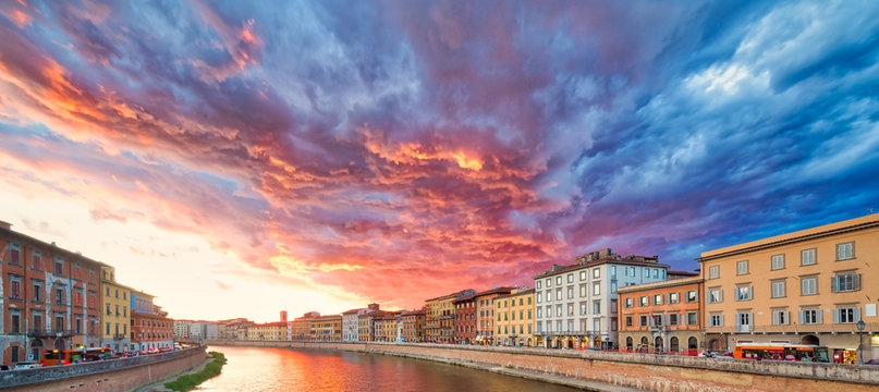 scenic sunset on river in Pisa