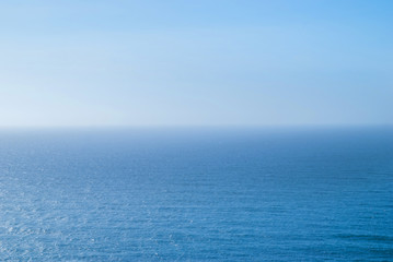 Obraz premium perfect clear blue sky and water of Atlantic Ocean.