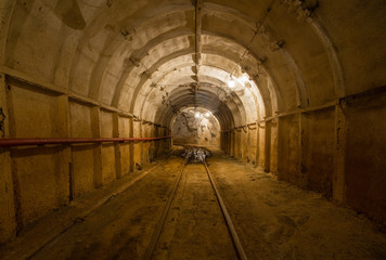 Emerald mine shaft tunnel gallery ore mine with light