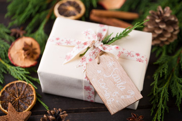 Christmas gift on the antique wooden background.