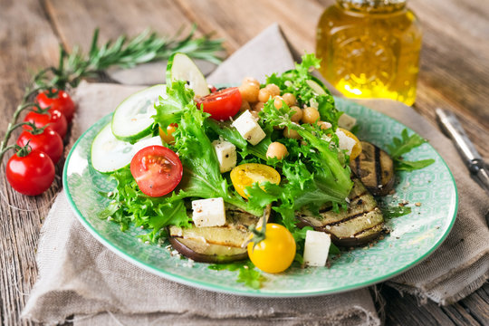 Fresh healthy salad with chickpea and griled eggplant