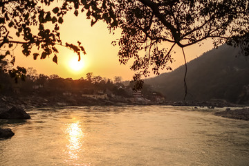 Sunset on Ganga river in Rishikesh, Uttarkhand, India - obrazy, fototapety, plakaty