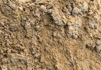 Naklejka premium Gray sand mound pile beach part background texture