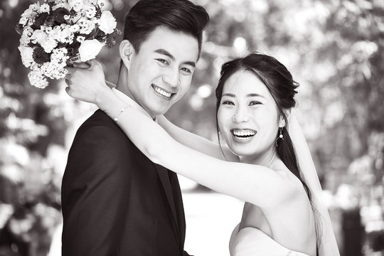 loving asian newly-wed couple