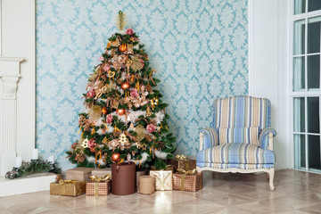 Classic green tree decorated in christmas toys. Merry christmas and new year interior background.