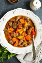 Meat stewed with vegetables in tomato sauce (hungarian gouliash).Top view .