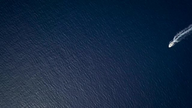 Aerial view of two motor boats crossing the sea navigating fast