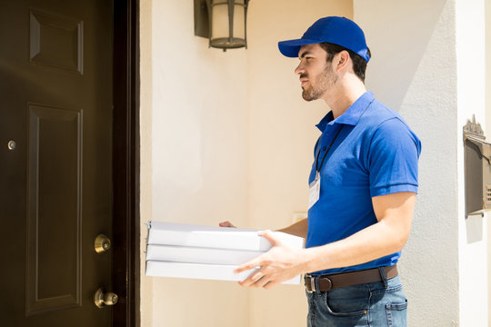 Young Man Delivering Some Pizza