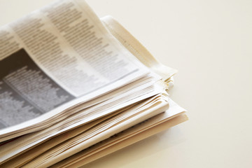 Newspaper with coffee on brown background