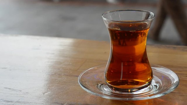 Turkish tea and simit on wooden table.