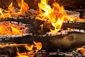 Bright hot fire flame burnt board orange background