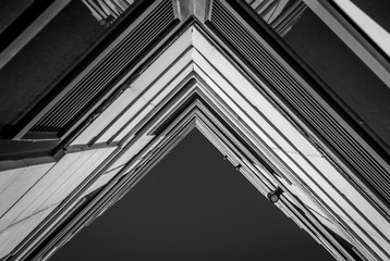 Urban Geometry, looking up to building. Modern architecture black and white, concrete and glass. ...