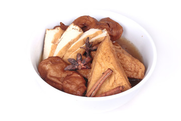 Chinese Vegetable festival  food as fried tofu and fermented flour in brown soup.