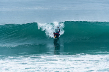 Bodyboarder surfing ocean wave