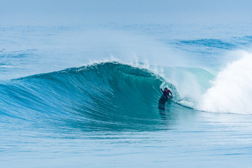 Bodyboarder surfing ocean wave