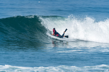 Bodyboarder surfing ocean wave