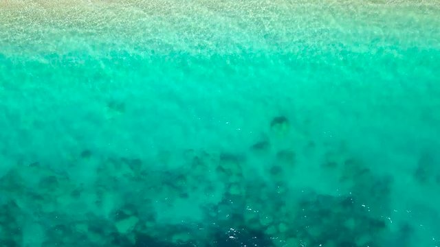 Aerial survey from a drone over the surface of the sea near shore