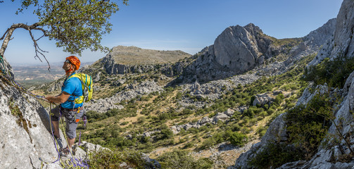 Fototapeta premium Man climbing high mountain