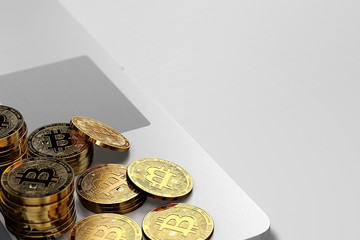 Close-up shot on Bitcoin piles laying on laptop keyboard on bright background. Bitcoin trading concept. 3D rendering