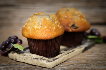 Still life blueberry muffins in a rustic style.