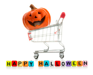 Pumpkin, Jack O in Shopping cart  and colorful wooden blocks isolated