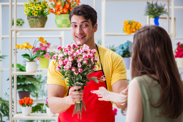 Florist selling flowers in a flower shop