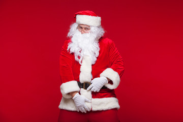 Santa Claus is dancing Isolated on red background.