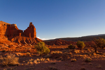Amazing desert landscape and view of Chimney Rock in Capitol Reef National Park at sunset in Utah.