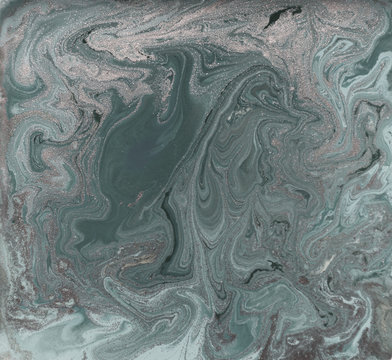 Liquid gold marbled pattern. Pale green background.