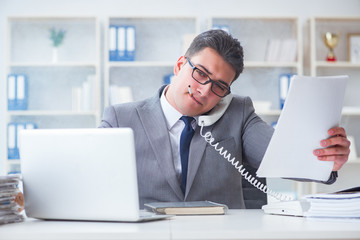 Fototapeta premium Businessman smoking in office at work