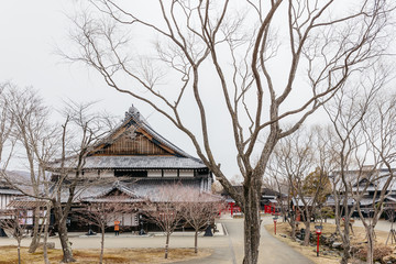 Edo period architecture style with leaves less tree in Noboribetsu Date JIdaimura Historic Village at Hokkaido, Japan.
