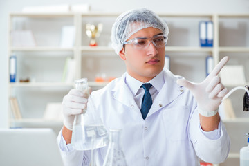 Young researcher scientist doing a water test contamination expe