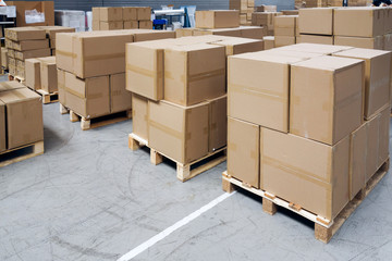 Stack of carton boxes at logistics warehouse