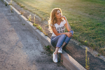 Happy woman in white T-shirt with word 