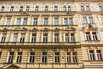 Fototapeta na wymiar Traditional facade of buildings, exterior of buildings in Prague. Close-up of beautiful historic buildings standing tightly together