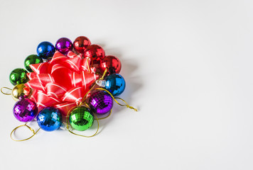 Red Christmas decorations on a light background. Christmas card. Winter holiday theme.