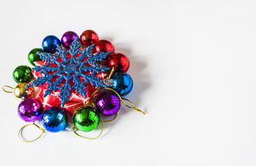 Red Christmas decorations on a light background. Christmas card. Winter holiday theme.