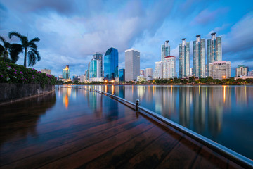 Obraz premium Bangkok city downtown at night with reflection of skyline, Bangkok,Thailand