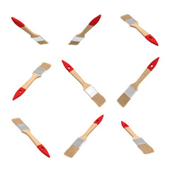 3d rendering of many new wooden paint brushes in different angles hanging on a while background.