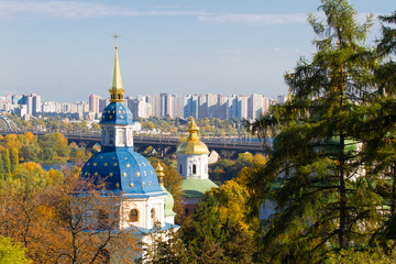 Fototapeta na wymiar Vydubychi Monastery located with panoramic view on Kiev. Panoramic view of Kiev, Ukraine. Botanical Garden