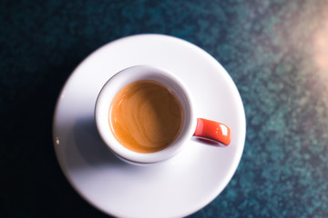 A cup of coffee on a gray background